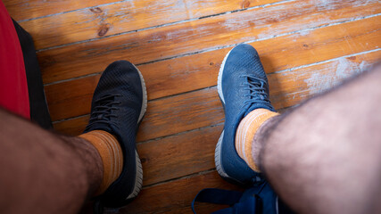 Point of view of man wearing running shoes