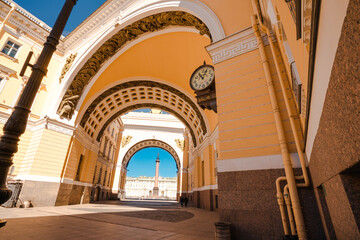 Yellow arch leading to the Palace square to the Hermitage Museum in Saint Petersburg, a tourist...