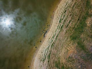 Landscape photo with patterns half with green lake waters