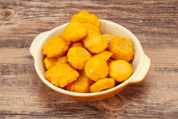Marinated yellow patisson in the bowl