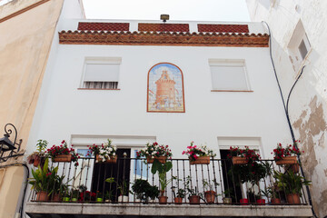 Low angle view of painting on tile on facade of house in Catalonia, Spain