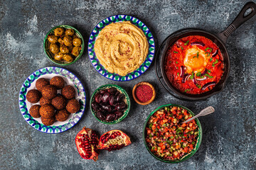 Falafel, hummus, shakshuka, Israeli salad - traditional dishes of Israeli cuisine.