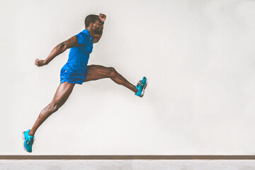 Athletic afro american man jumps to the gym