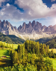 Countryside view of the Funes valley St. Magdalena or Santa Maddalena in the National park Puez Odle or Geisler. Dolomites, South Tyrol. Location Bolzano, Italy, Europe. Dramatic scene. Beauty world.