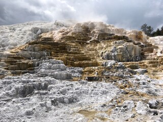 Fototapeta na wymiar Hot springs on mineral rock looking like snow at yellowstone