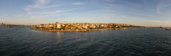 Fototapeta na wymiar Panoramic view of the Uskudar district of Istanbul from the Bosphorus at sunset. Turkey