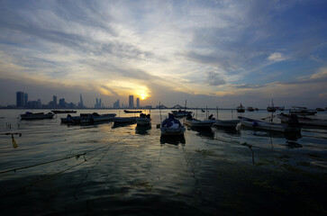 Bharain skyline fishing boats durng sunset, HDR image