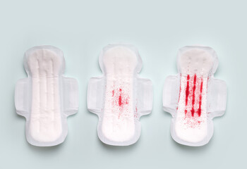 The menstrual cycle in women. Gaskets on a blue background