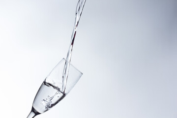 water falling into a clear glass