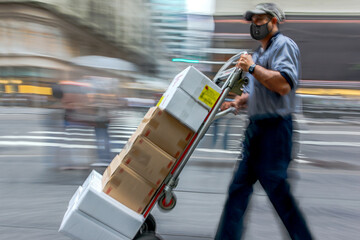 delivery with a cart manually in medical masks