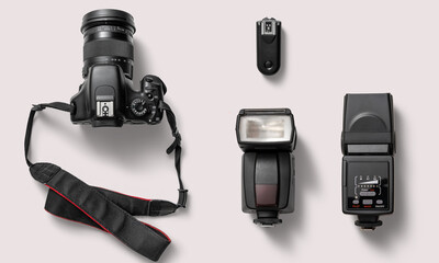 Camera with lens and accessories on a white background