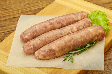 Raw pork meat sausages for grill