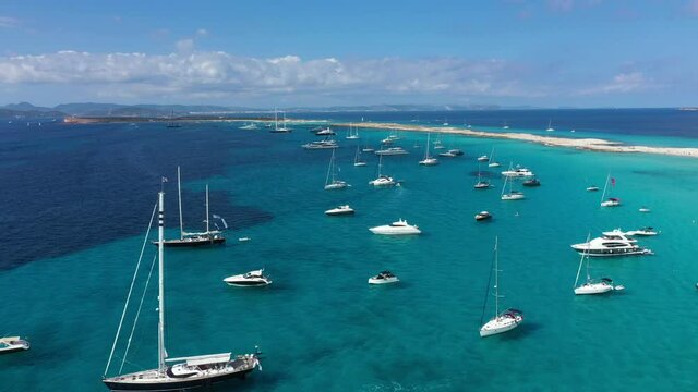 Aerial view of yachts in turquoise water near Formentera. Balearic Islands, Spain