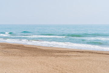 Fototapeta na wymiar Beach of the Ebro delta. Fine sandy beaches and flat waters.