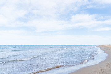 Fototapeta premium Side of the beach without people, with some small waves to make it beautiful.