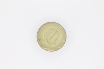 Green texture of cream on white background