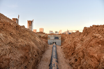 Construction of stormwater pits, sanitary sewer system distribution chamber and pump station....