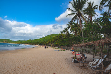 Beautiful beach in the Philippines with blue sky and palm trees