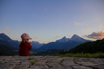 Fototapeta premium Girl in the mountains. Having a snack whit nice mountain views. 
