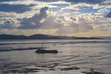 Beautiful cloudy beach with sunset in the Philippines