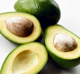 Fresh avocado slices on white background 