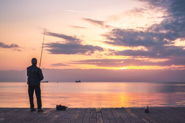 Fisherman Fishing In The Sunset