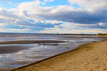 Seascape of sea water and beach, sand and clouds , horizon.