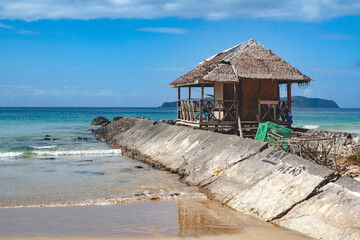 Remote wooden building on the beach of Nacpan, El Nido, Philippines