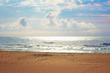 Fototapeta na wymiar sandy beach and sunlight over the sea