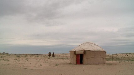 Kazakhstan vast deserts with cattle chasers, wild horses and camels.
