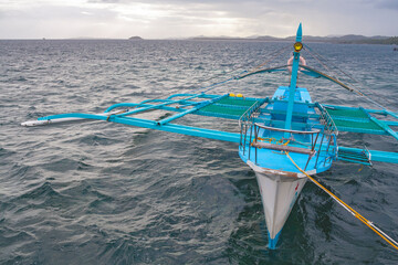 A traditional fishing boat on the sea in Siargao, Philippines