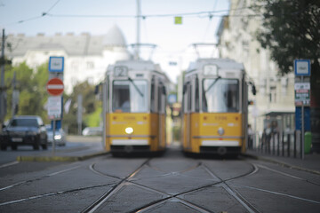 Naklejka na ściany i meble trams city landscape, blurred background traditional european city view, lifestyle