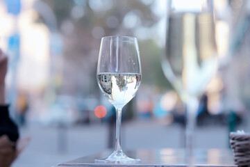 glass white wine restaurant interior, abstract evening dinner with alcohol at the bar