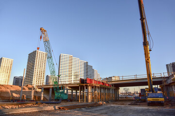 Work of truck crane and crawler crane on bridge project works. Roundabout traffic bridge...
