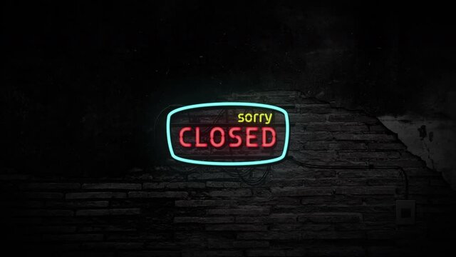 Sorry closed neon sign on brick wall background. Business and service concept.