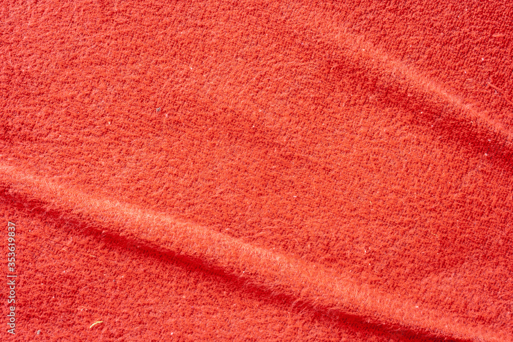 Poster close-up red textile texture for background. fabric pattern. abstract material structure.