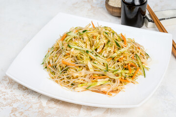Chinese salad of fresh vegetables, noodles, cabbage