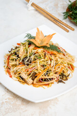 Chinese salad of fresh vegetables, noodles, cabbage
