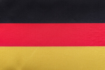 National flag of Germany close up. Tricolor flag of black, red, yellow