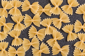 Raw Pasta close up for background. Raw bow tie pasta. Italian cuisine.