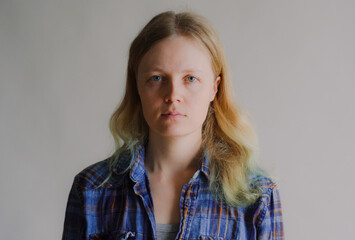portrait of a simple serious woman without makeup