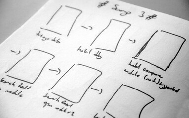 screen design drawings and wireframes made on white paper