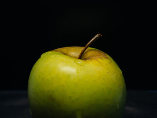 green apple on black