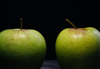 green apples on black background