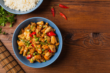 Chicken kung pao. Fried chicken pieces with peanuts and peppers.