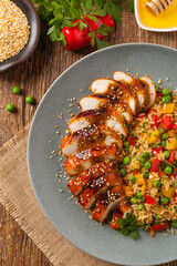 Grilled chicken breast in teriyaki sauce. Served with brown rice and vegetables.