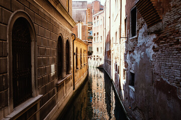 Obraz na płótnie Canvas Venetian streets-canals at noon