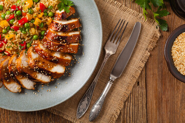 Grilled chicken breast in teriyaki sauce. Served with brown rice and vegetables.