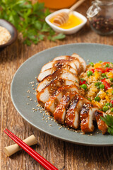 Grilled chicken breast in teriyaki sauce. Served with brown rice and vegetables.