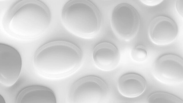 Abstract Organic Dimple Surface Loop 1 White: smooth clean glossy white surface with rounded holes like coral. Abstract biology concept. Biochemistry concept. Bright background. Seamless loop. 4K
